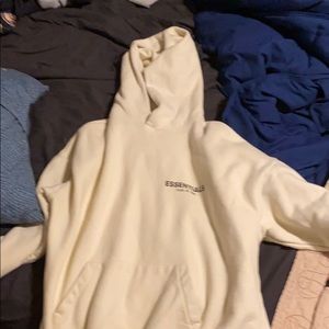 Fear of god essentials hoodie logo